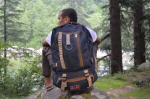 Man with backpack in the woods
